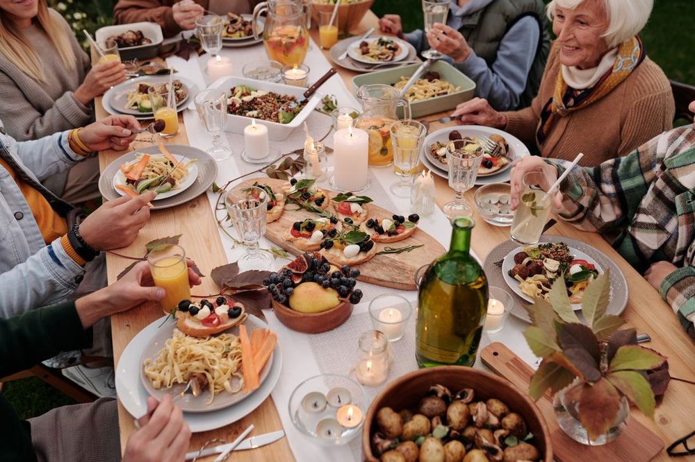 A multigenerational family sharing a home-cooked feast around one table