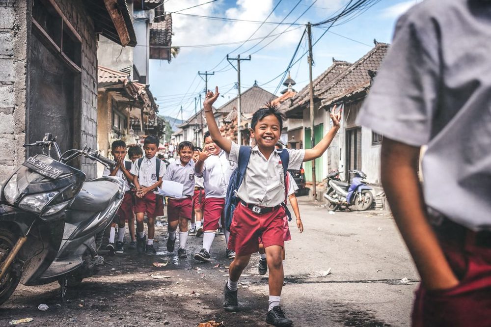 Children celebrating joyfully on their neighborhood street